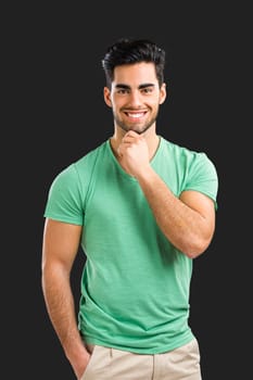 Portrait of handsome young man, isolated on gray background