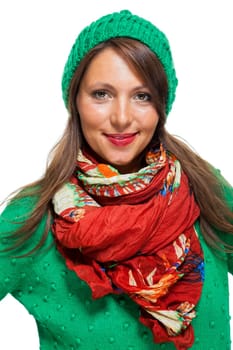 Attractive young woman with long dark hair with green beanie sweater and red scarf fashionable in portrait
