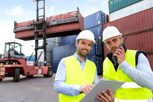 View of a Dock worker and supervisor checking containers data