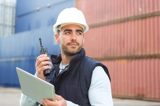 View of a young Attractive docker using tablet at work