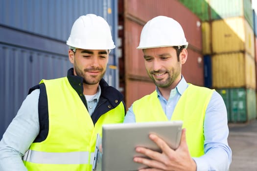 View of Two young attractives dockers working on the dock