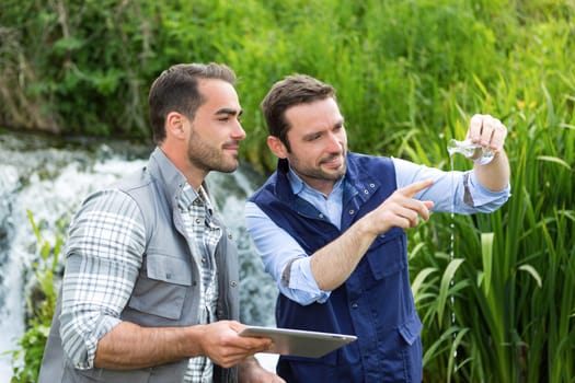 View of a Scientist and biologist working together on water analysis