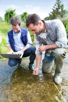 View of a Scientist and biologist working together on water analysis