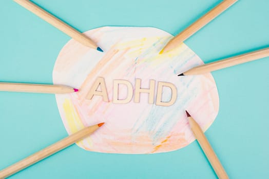 ADHD, attention deficit hyperactivity disorder, mental health, colored paper with pencils