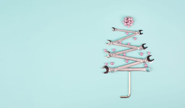 Christmas tree made with wrenches, baubels and a star, new year greeting card with repair tools