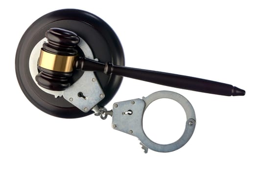 Judge's hammer and handcuffs on white isolated background. High quality photo