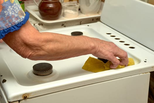 wet cleaning of the gas stove. High quality photo
