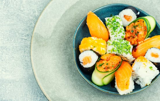 Delicious sushi rolls on the plate. Sushi menu. Japanese food.