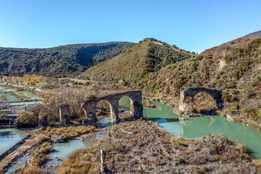 Roncalese bridge, Medieval construction, with seven arches, semi-ruined, located over the Aragón river near the town of Yesa, next to the fish farm. It has been part of the Camino de Santiago