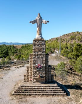 Sanguesa, Spain - November 10, 2022: In 1945 the Sacred Heart of Jesus was consecrated to Sanguesa. Sculptor work Jose Larrea Echeniz, base of 8 m. by the architect Salvador Gayarre