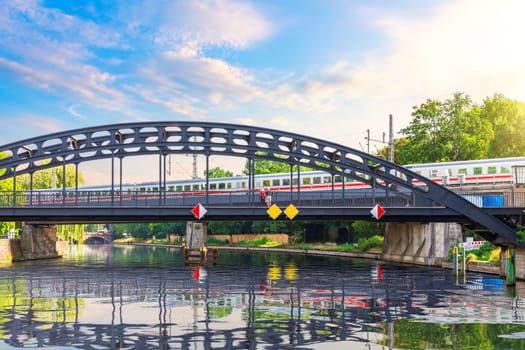 German railways over the Spree river, beautiful sunny image of modern Berlin, Germany.