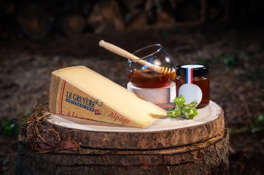 July 12 2022, Lyon, France : Tasted famous swiss cheese, Le Gruyere d'Alpage and honey for lunch and food experience