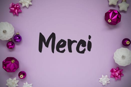 Christmas Card With French Text Merci Means Thank You. Purple Christmas Background With Romantic And Brilliant Decoration Like Balls.