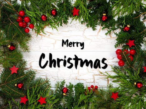 Christmas Card With Fir Branches And English Text Merry Christmas. White Wooden Background With Vintage Design And Christmas Decoration Like Red Ornament Balls.