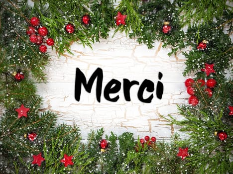 Christmas Card With Fir Branches And French Text Merci Means Thank You. White Wooden Background With Vintage Design, Christmas Decoration Like Red Ornament Balls And Snowflakes.
