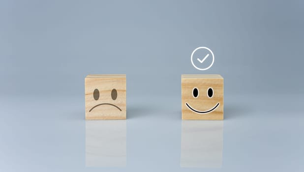 The correct sign is on a wooden block with a smiley icon. represents feedback rating and positive customer review, Satisfaction Concept, satisfaction survey ,mental health assessment, think positive concept