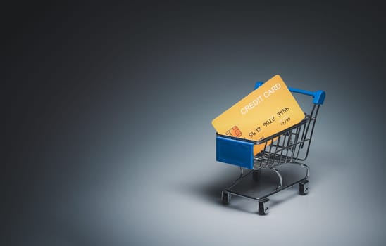 Shopping car and mockup credit card  on light and shadow background. shopping online concept.