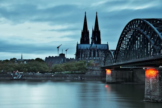 Cologne Cathedral and the Hohenzollern Bridge at dusk