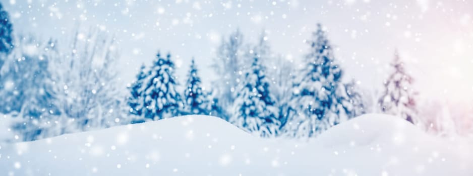 Closeup view of the slope snowdrift in spruce forest in snowfall. Panoramic background.