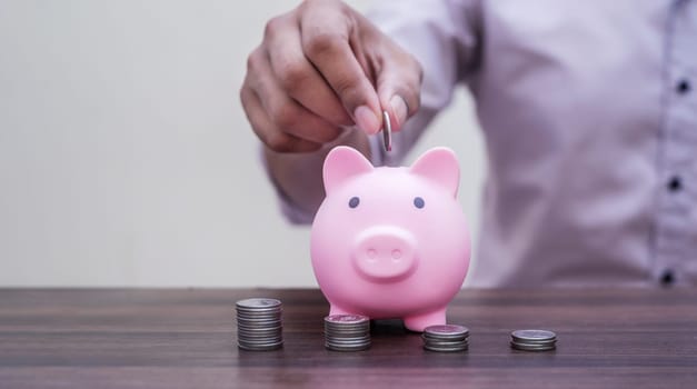Save money and account banking for finance concept, Piggy bank with coin on blurred background, Save Monney for Investors Using Internet to Trade Stocks or Trade Fund