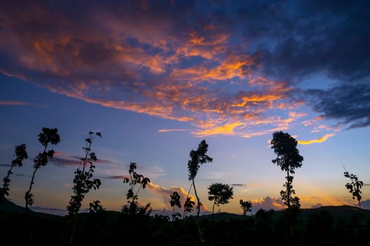 View of Colorful dramatic sky sunset or sunrise with clouds background on Mountain