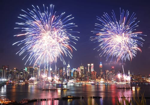 NEW YORK CITY - JUL 4: New York City Manhattan Independence Day firework show in Hudson River as annual traditional event to celebrate the birth of United States, July 4, 2010 in Manhattan, New York City.