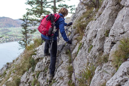 woman on climbing route in the Austrian Alps, Traunstein, Upper Austria, Austria