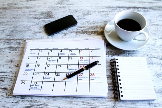 Checking monthly activities and appointments at the office.