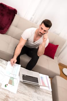 Businessman working at home in the laptop.
