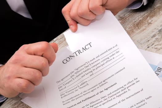 A businessman reading a Contract before signing.
