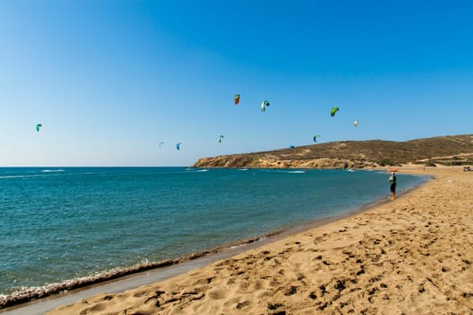 Prassonissi view of the beach with surfers in the background