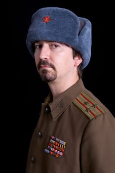 young man dressed as russian military, studio