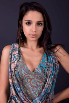young beautiful brunette portrait against black background