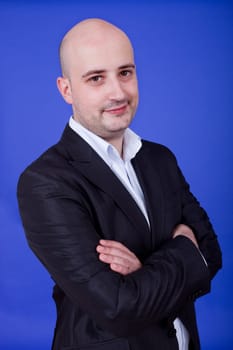 an young man portrait over a blue background