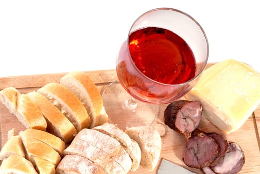 A set of food with red wine isolated on white