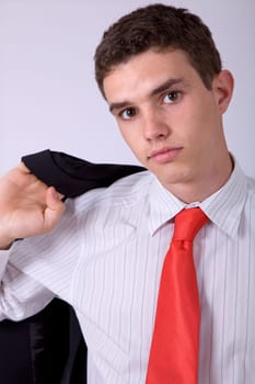 young business man pensive, on a grey background