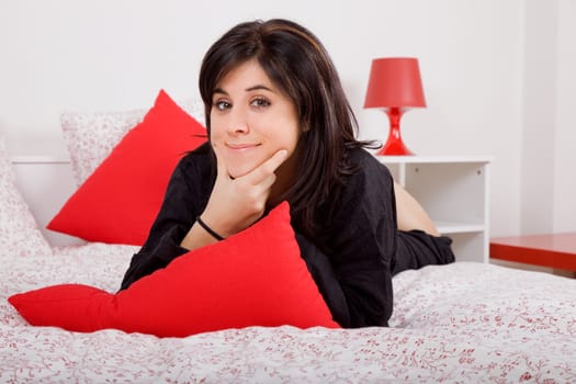 young beautiful sensual woman in bed, studio picture