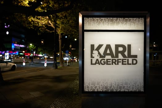 neon sign as outdoor advertising for a Karl Lagerfeld store on Kurfuerstendamm in Berlin at night
