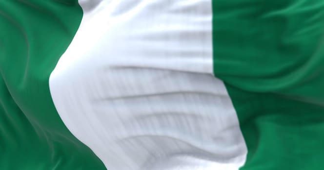 Close-up view of the Nigeria national flag waving. The Federal Republic of Nigeria, is a country in West Africa. Fabric textured background. Selective focus. 3D illustration
