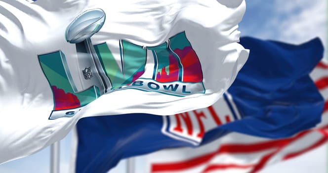 Glendale, US, Nov 2022: The flags of 57th Super Bowl, NFL and United States waving. The game is scheduled to be played on February 12, 2023 in Glendale, Arizona