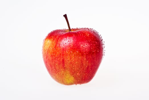 Red apple with water drops over white background - isolated