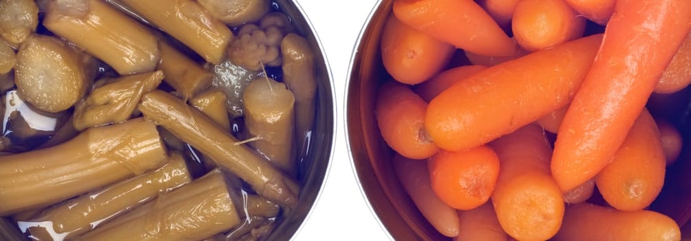 Variety of Canned Vegetables in Cans Including Carrots and ASparagus Isolated on White.