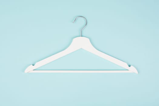 White hanger on a pastel background, fashion store, minimalism clothes, discount promotion