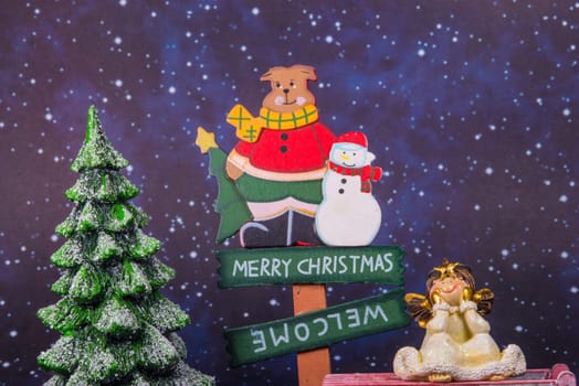 merry christmas board with angel and christmas tree