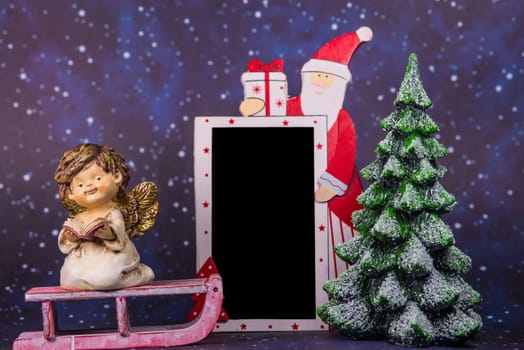 Santa Claus with empty blackboard