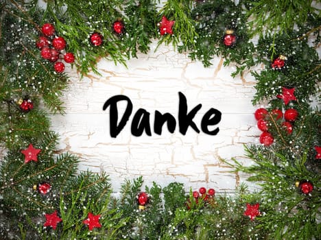 Christmas Card With Fir Branches And German Text Danke Means Thank You. White Wooden Background With Vintage Design, Christmas Decoration Like Red Ornament Balls And Snowflakes.