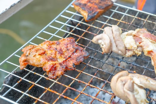 Grilled meat scorched on the grill, burnt