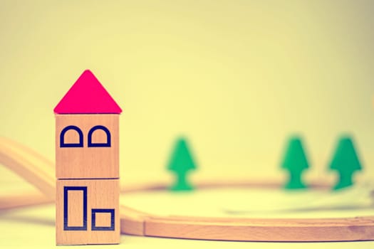 Model houses and trees on cream background