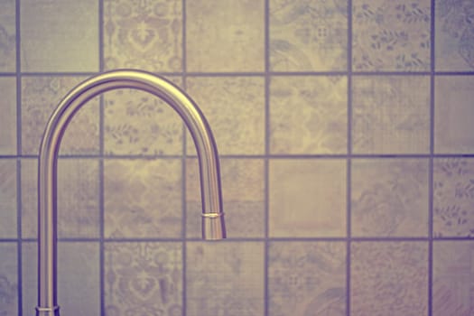 Water tap faucet in the kitchen for background