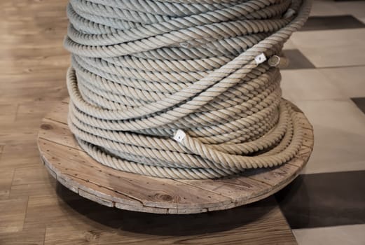 A drum with a coiled, wound rope, a rope.